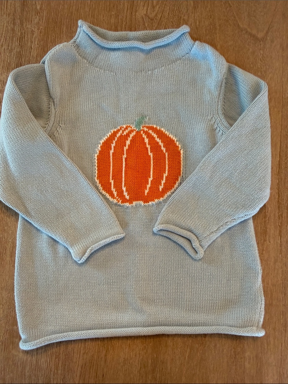 Little English light blue knit top with orange pumpkin